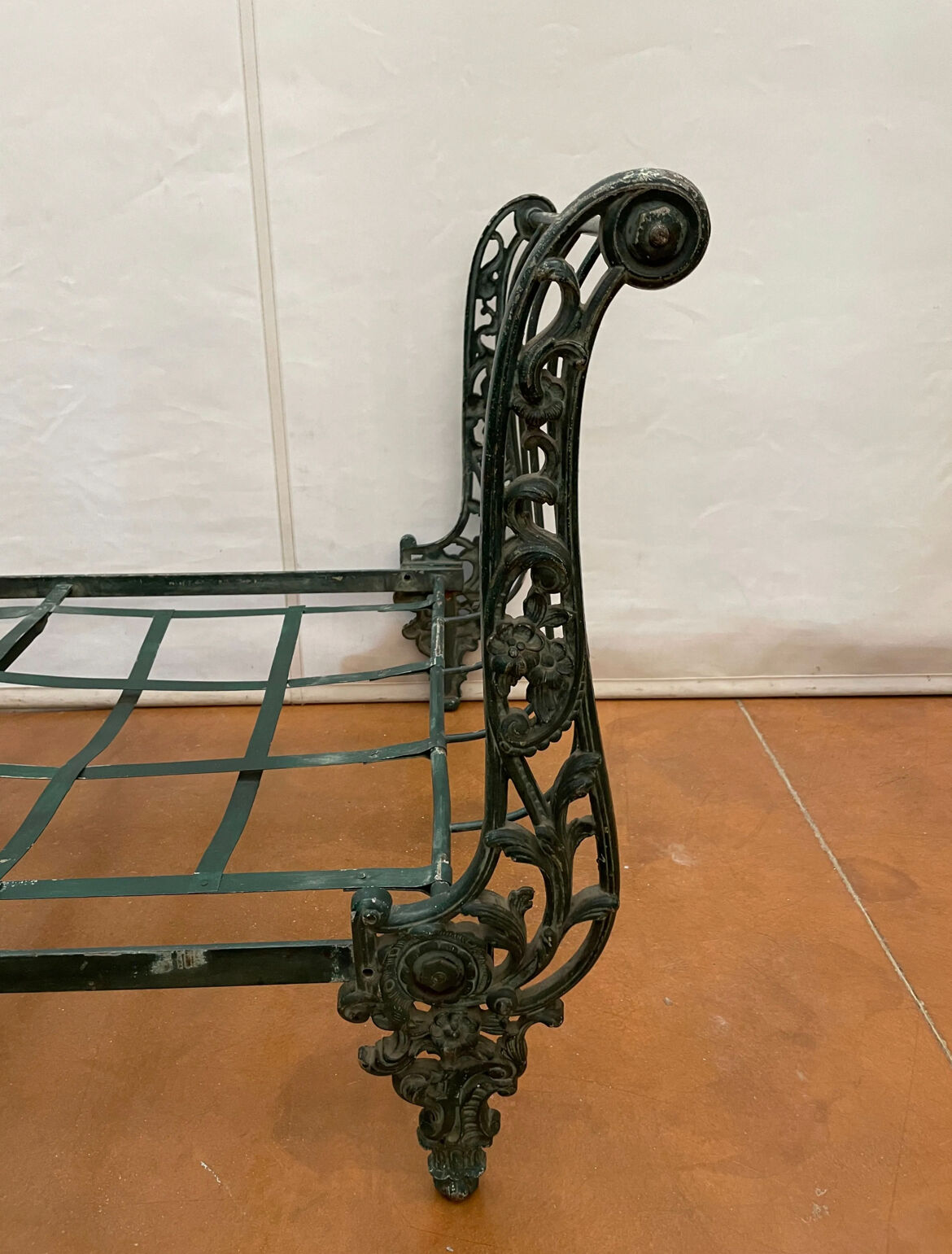 Cast iron bed with floral decorations