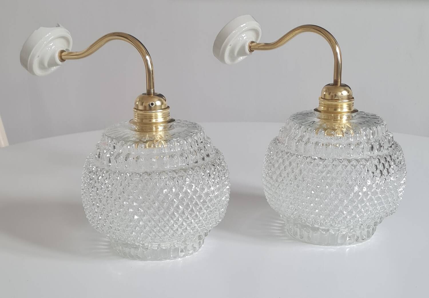 Pair of chiseled glass sconces