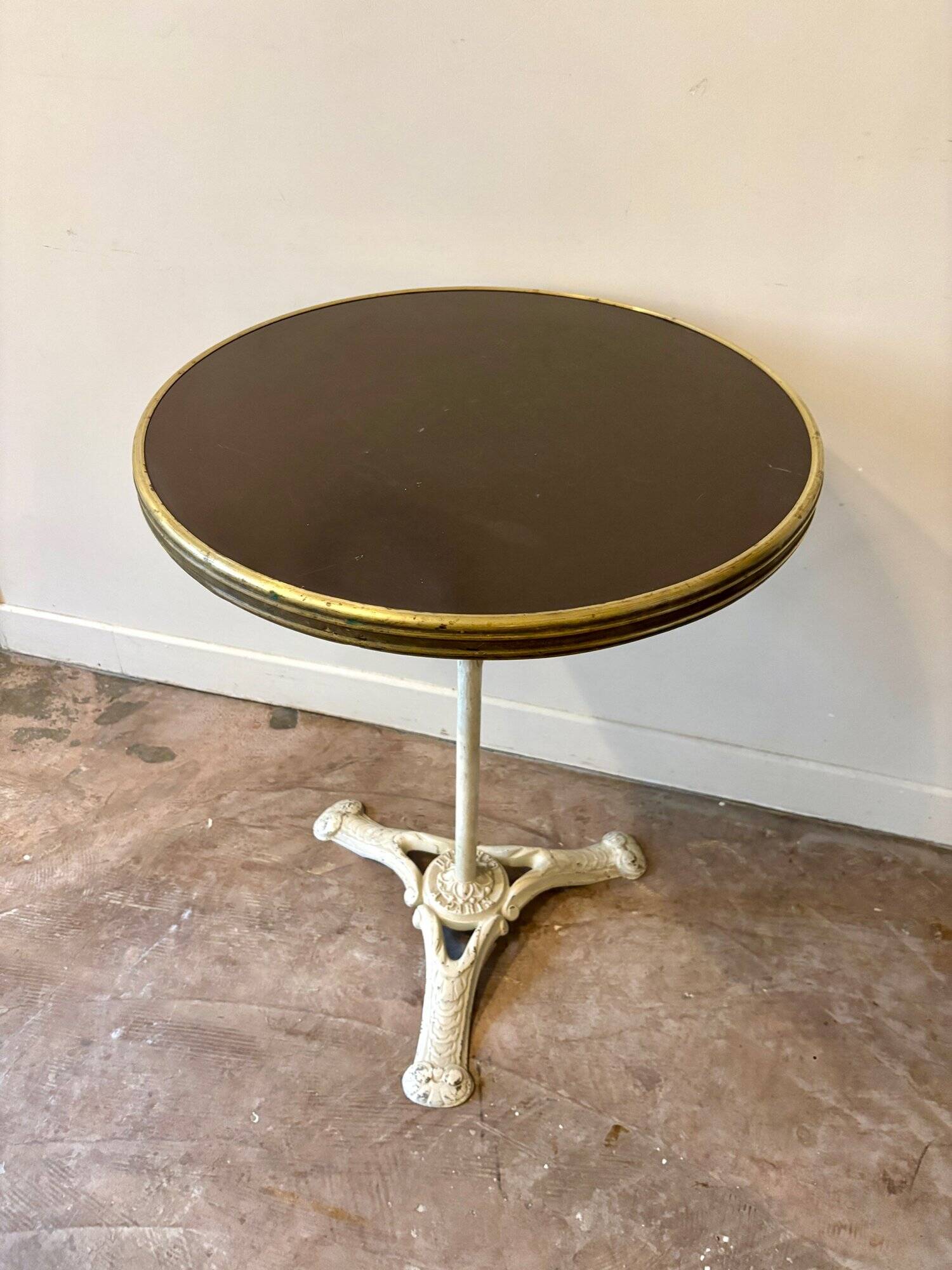 Bistro table in gray cast iron and brown melamine