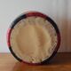 Vintage round pouf in red and black Skai