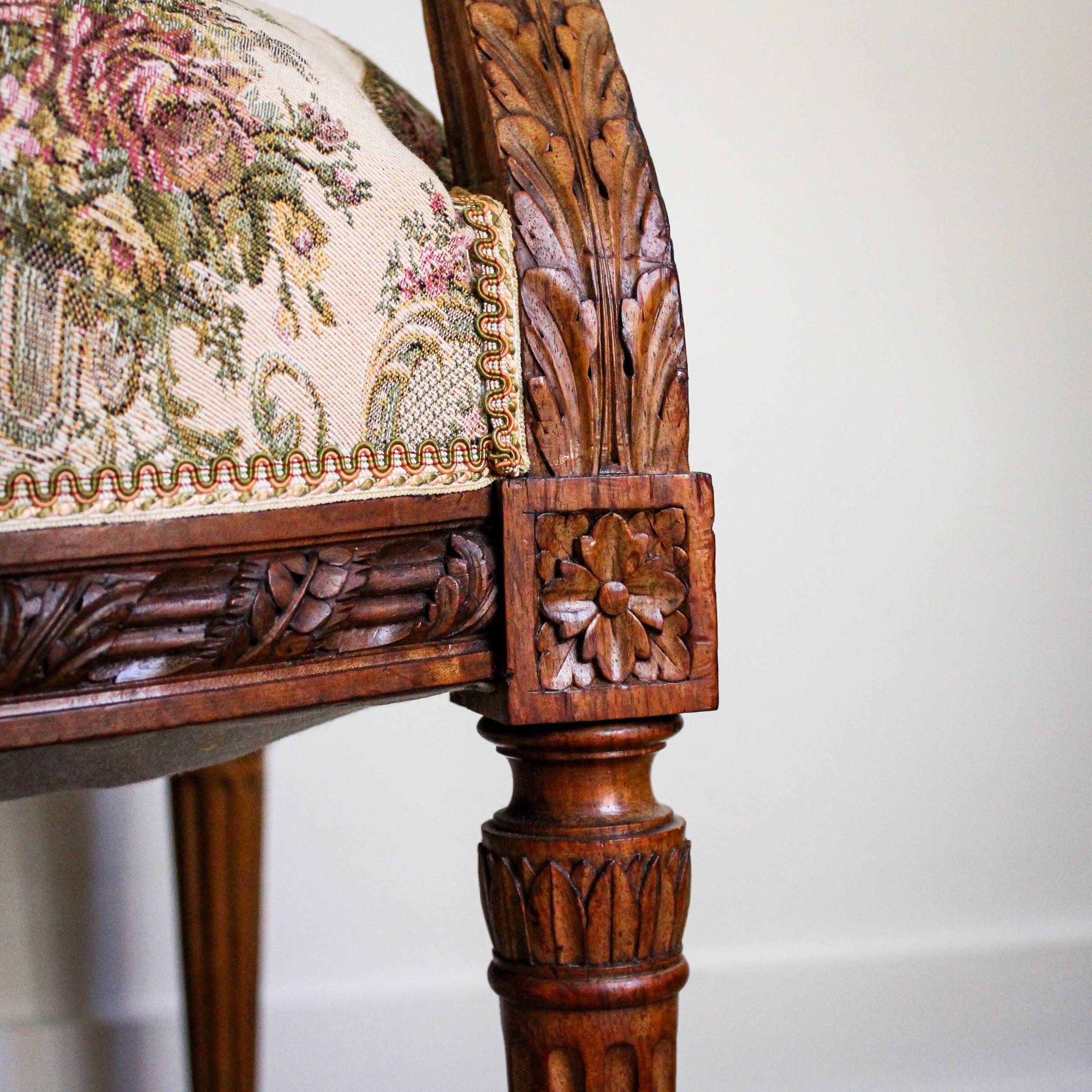 Louis XVI style carved armchair