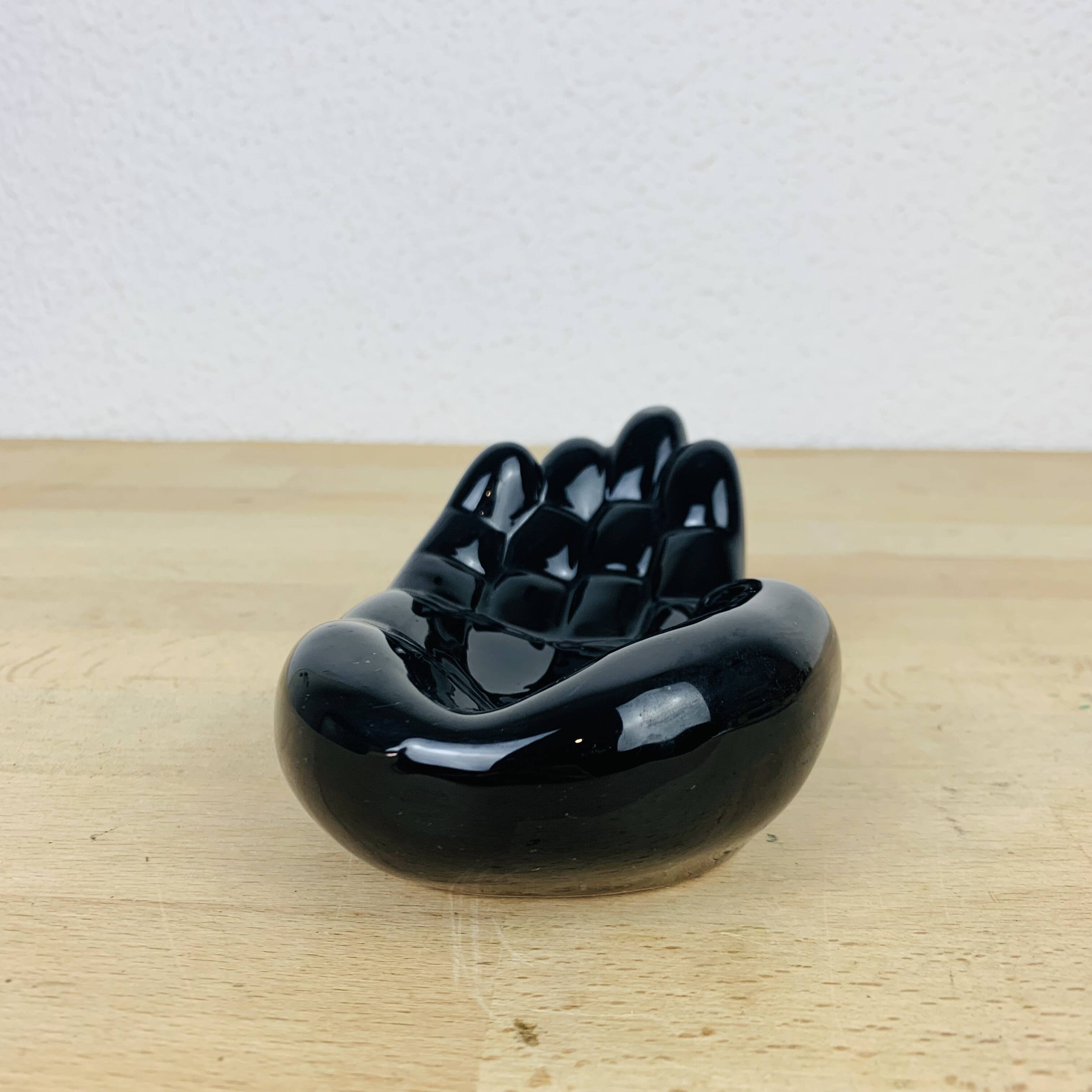 Vintage black ceramic hand pocket empty