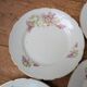 7 dessert plates in porcelain with a violet lilac design and a gold rim.