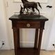 Antique small Empire console from the early 19th century in mahogany and marble.