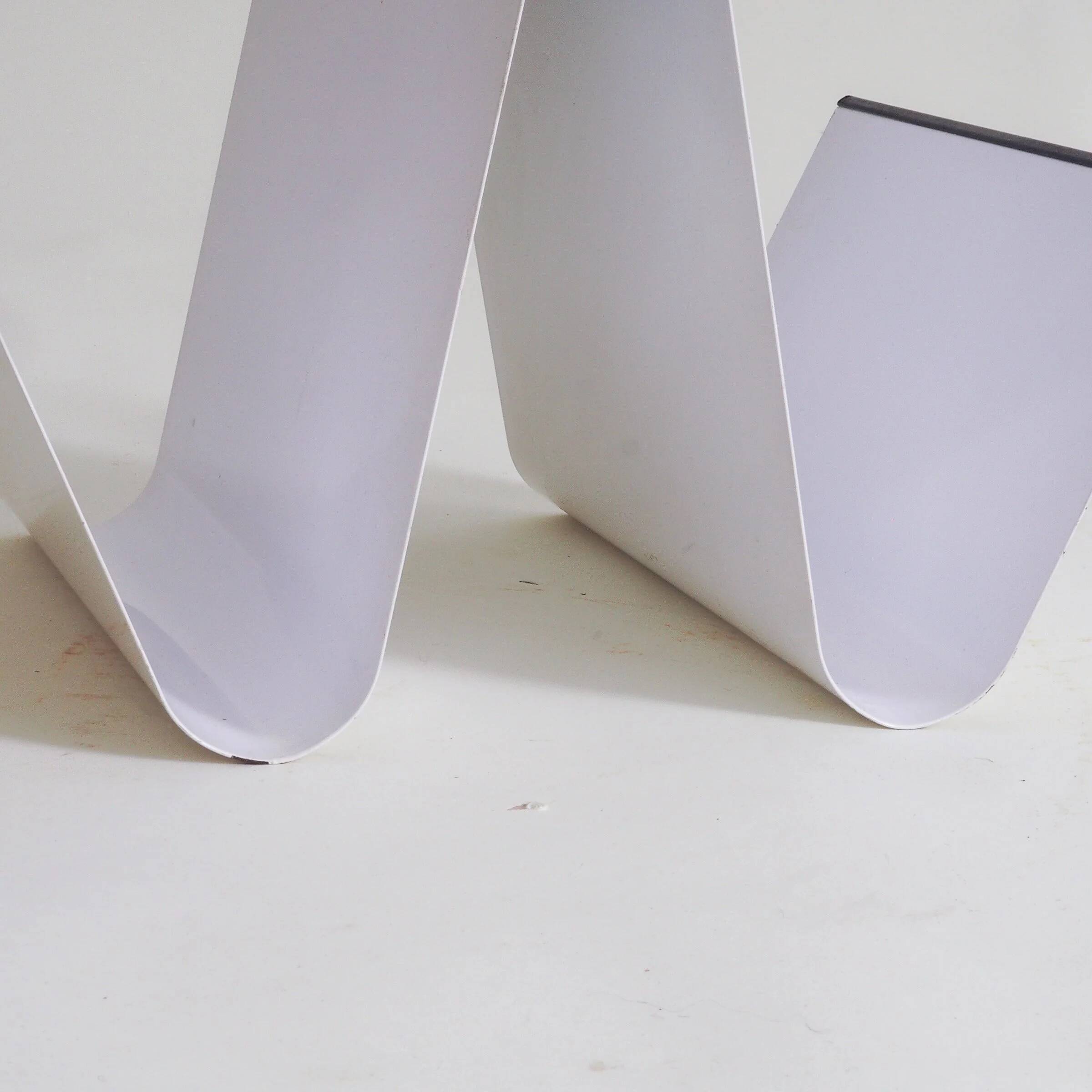 Metal magazine holder by Pete Sans for NRO