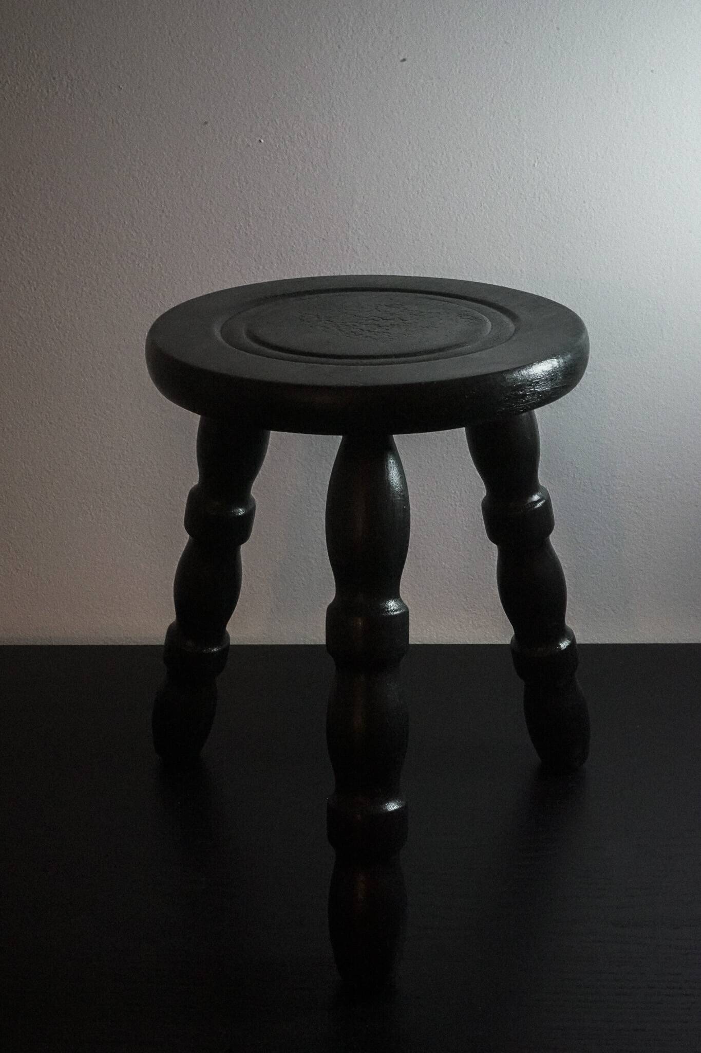 The small tripod in burnt oak wood