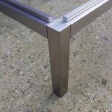 Table basse carrée en métal brossé avec verre fumé