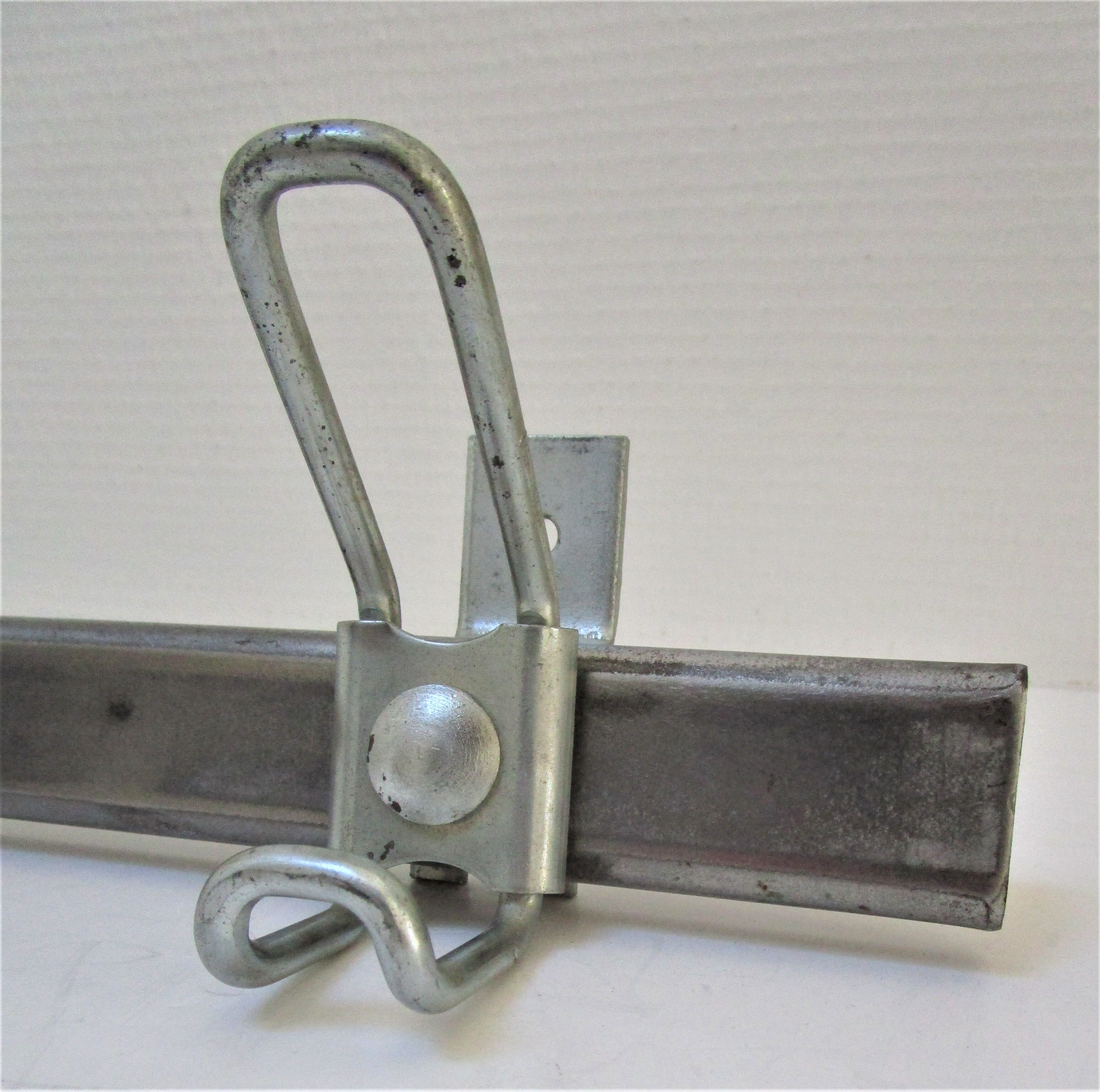 Vintage school wall rack in patinated steel
