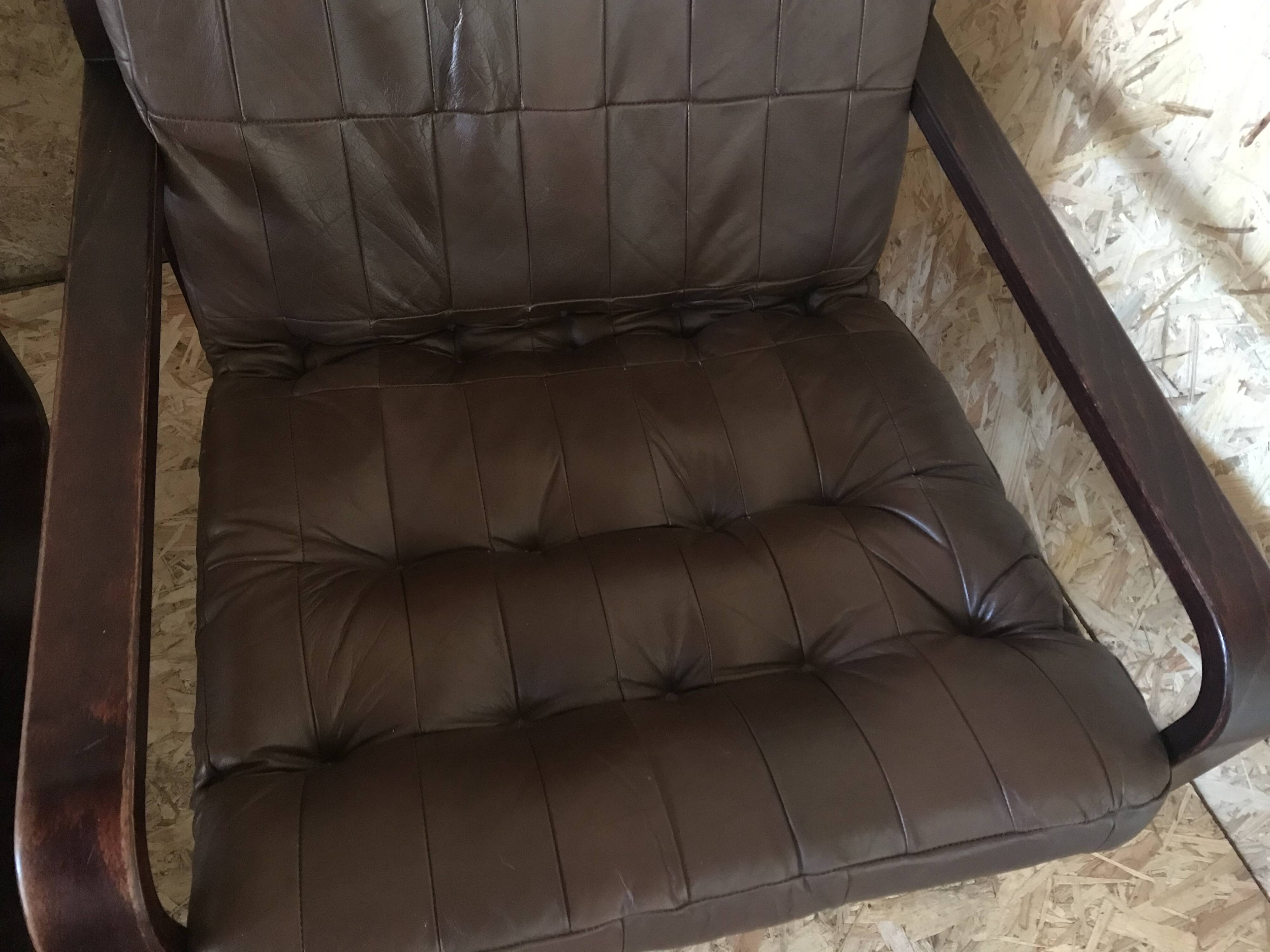 Pair of vintage armchairs in curved wood with suspended seat circa 1970-80.