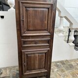 Man - standing - narrow two-door wardrobe with a central drawer