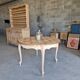 Round table made of cherry wood, sanded and varnished.
