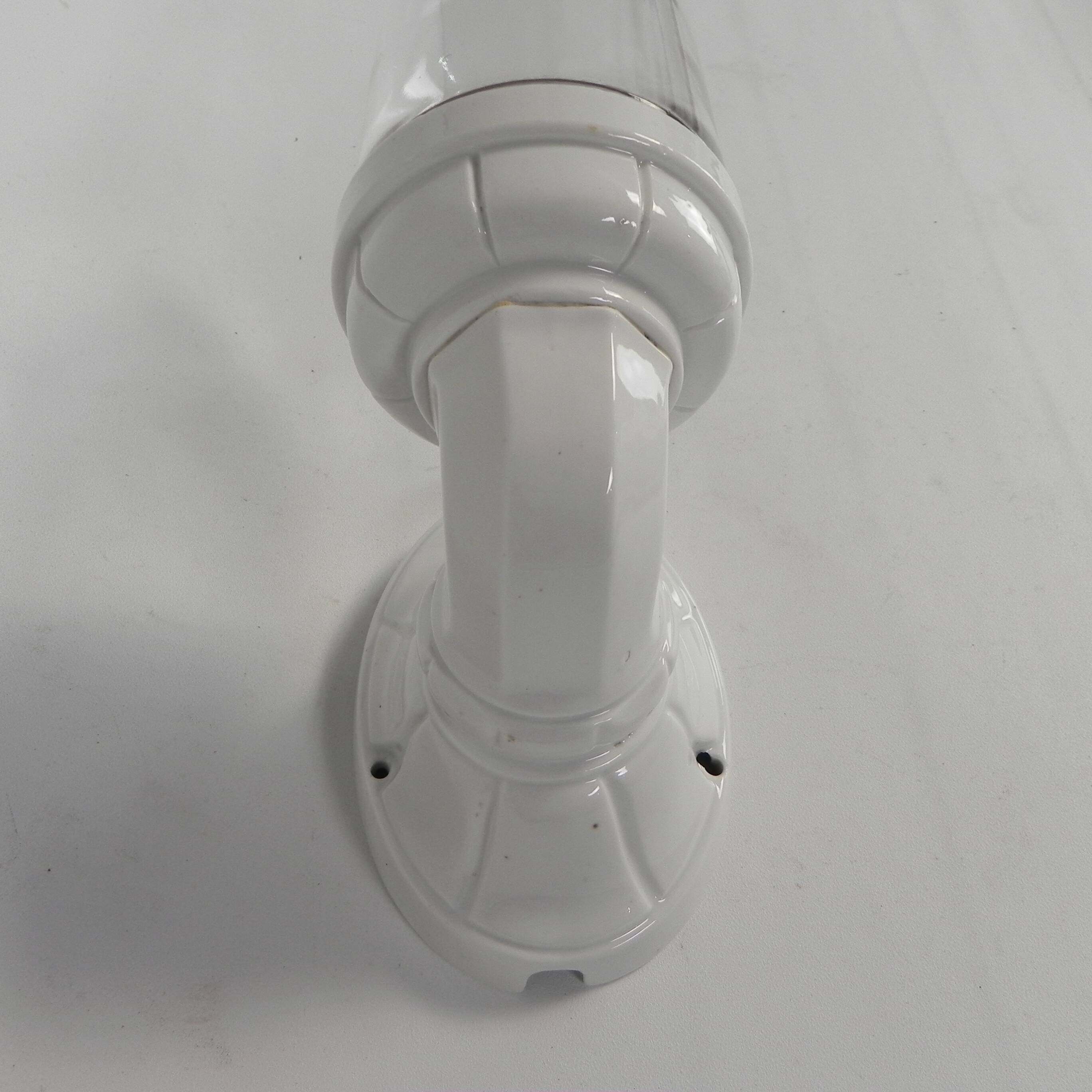 Wall lamp in porcelain with a transparent glass shade, 1930s.