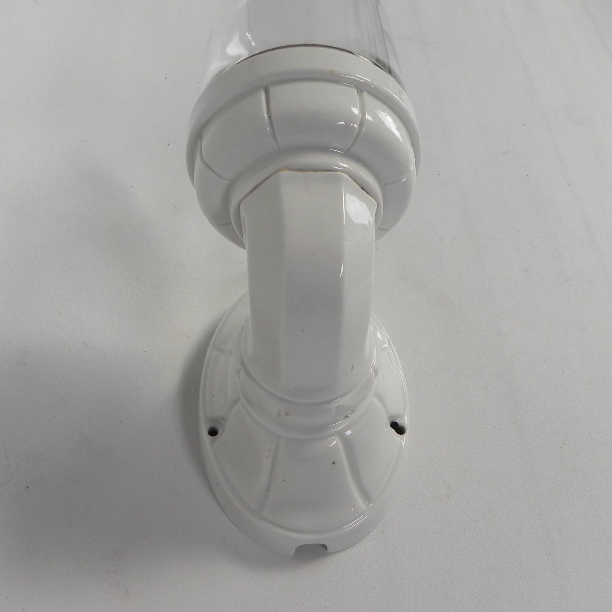 Wall lamp in porcelain with a transparent glass shade, 1930s.