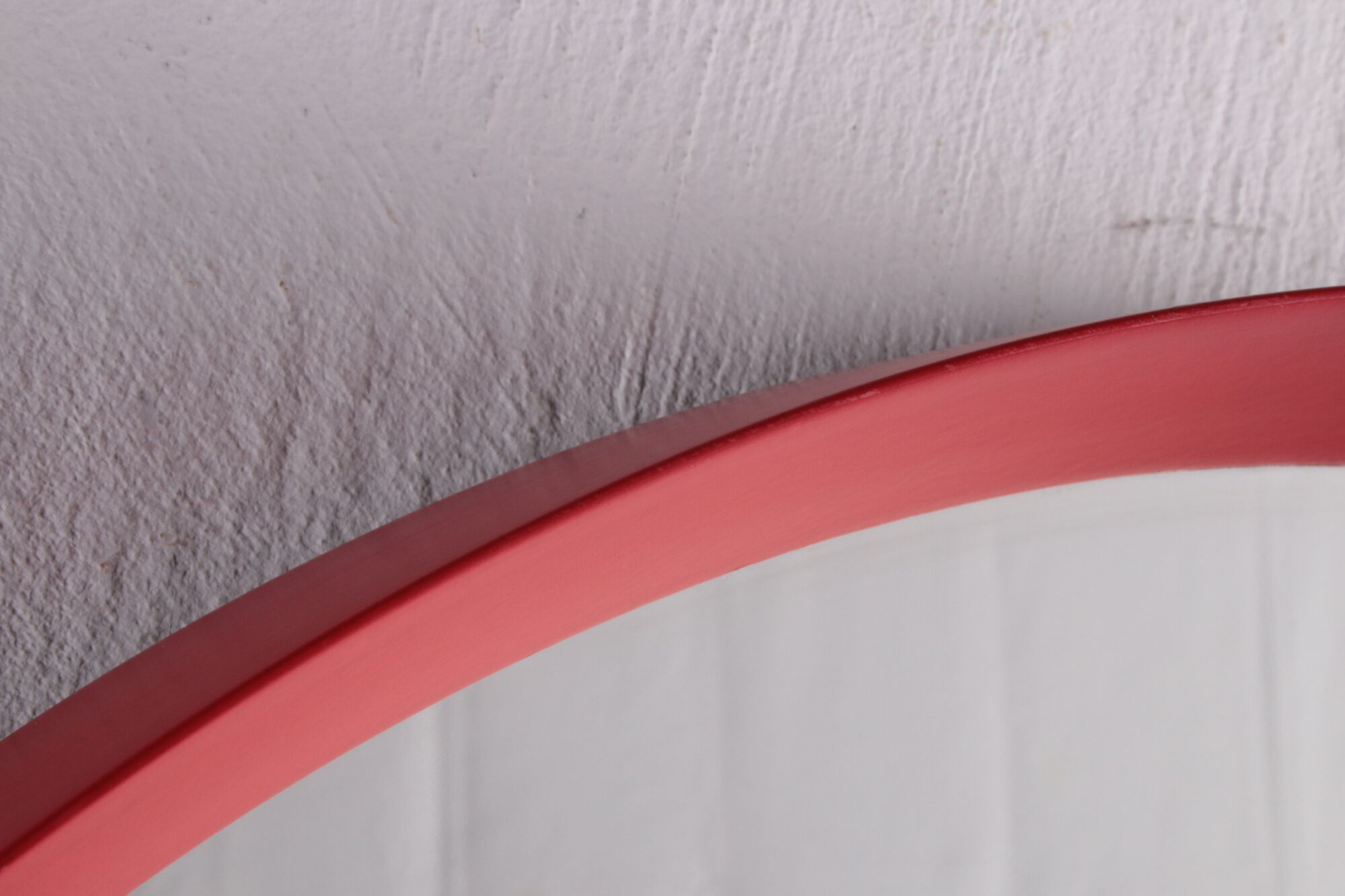 Vintage red round plastic mirror from the 1960s.
