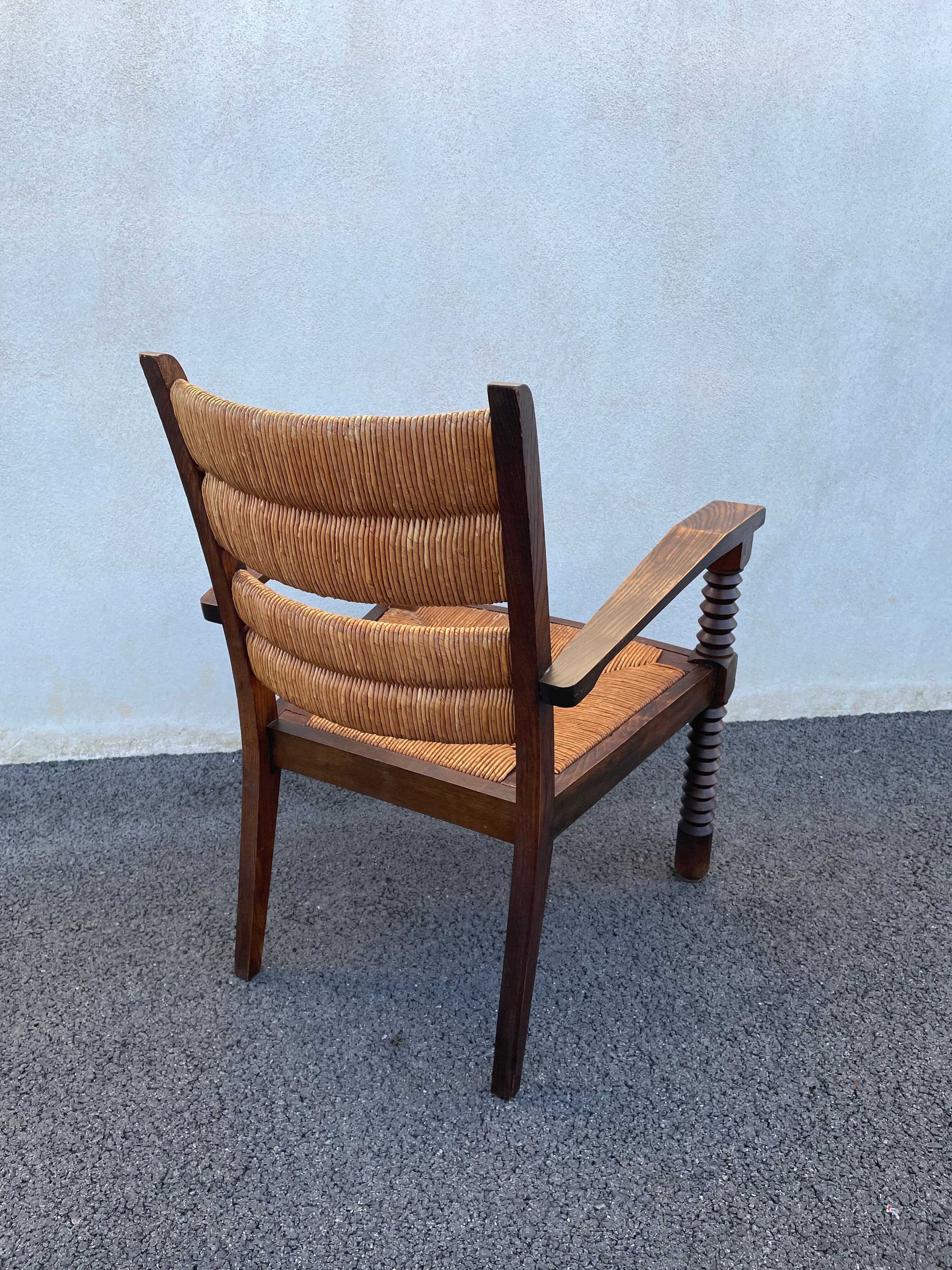 Vintage armchair in straw and brutalist wood