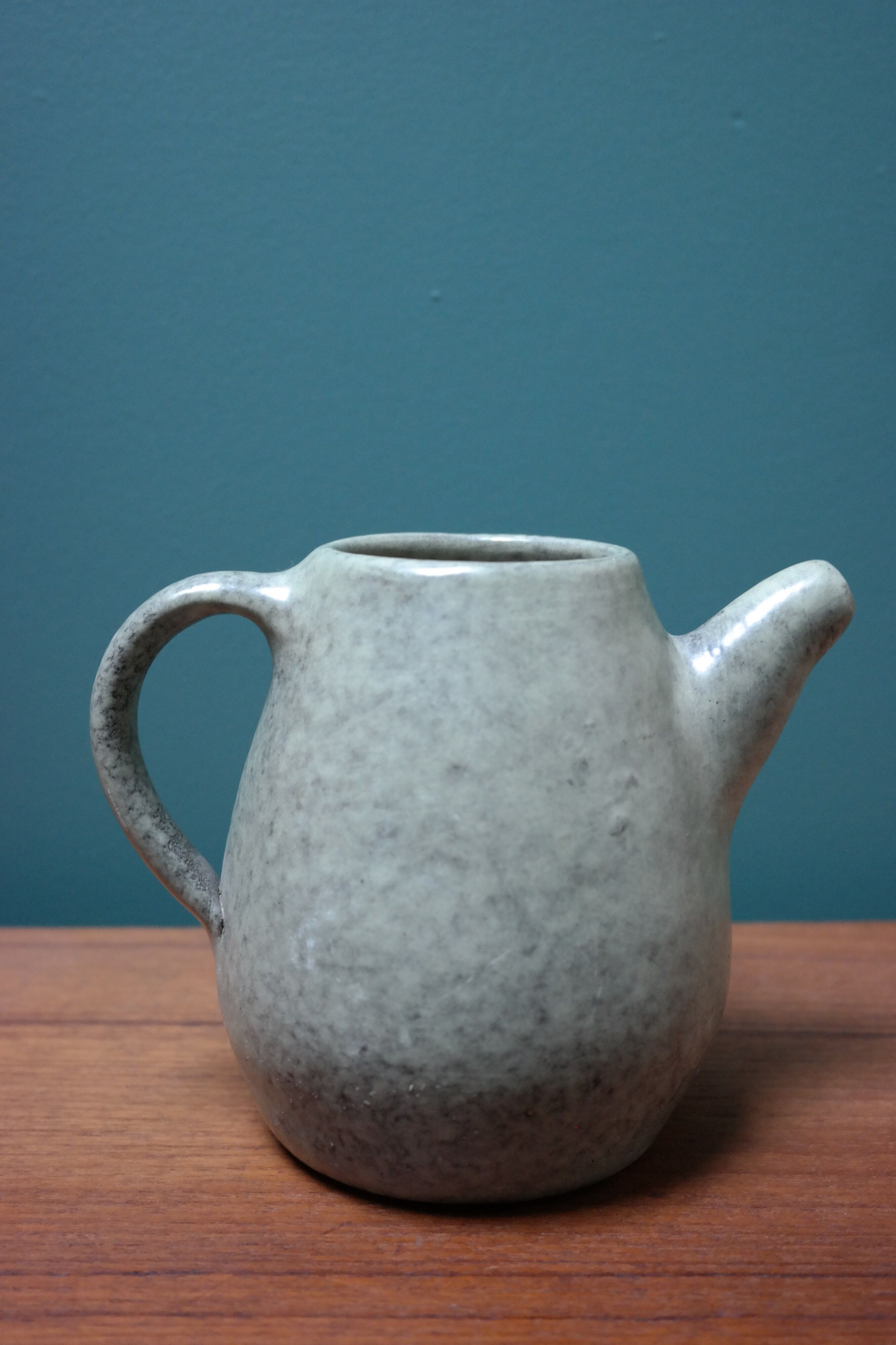 Small ceramic pitcher enamelled pale green, signed Max Idlas
