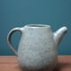 Small ceramic pitcher enamelled pale green, signed Max Idlas