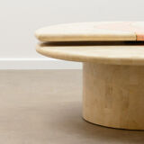 Travertine coffee table with swiveling top.