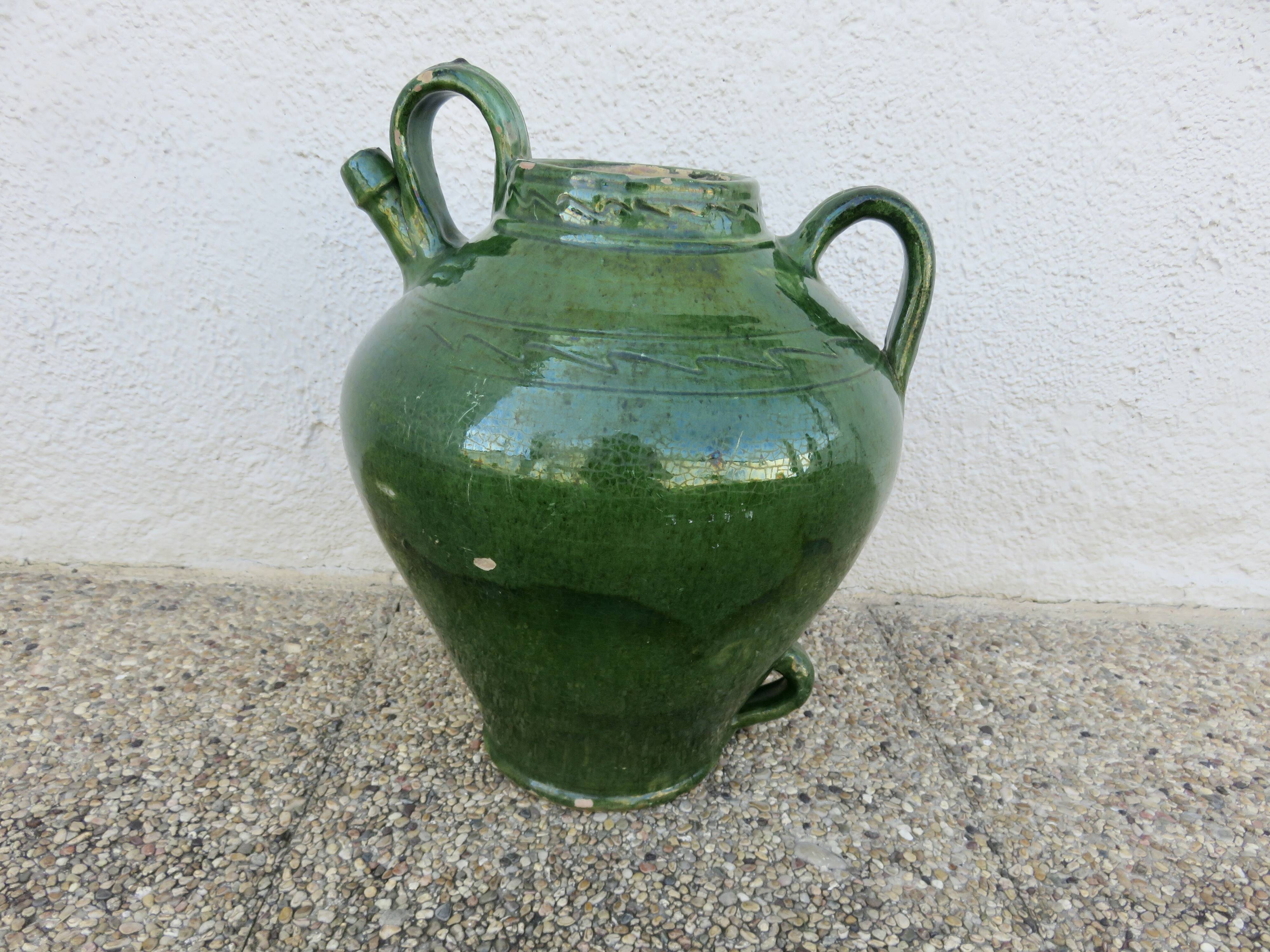 Antique glazed green terracotta oil jar, late 19th century.