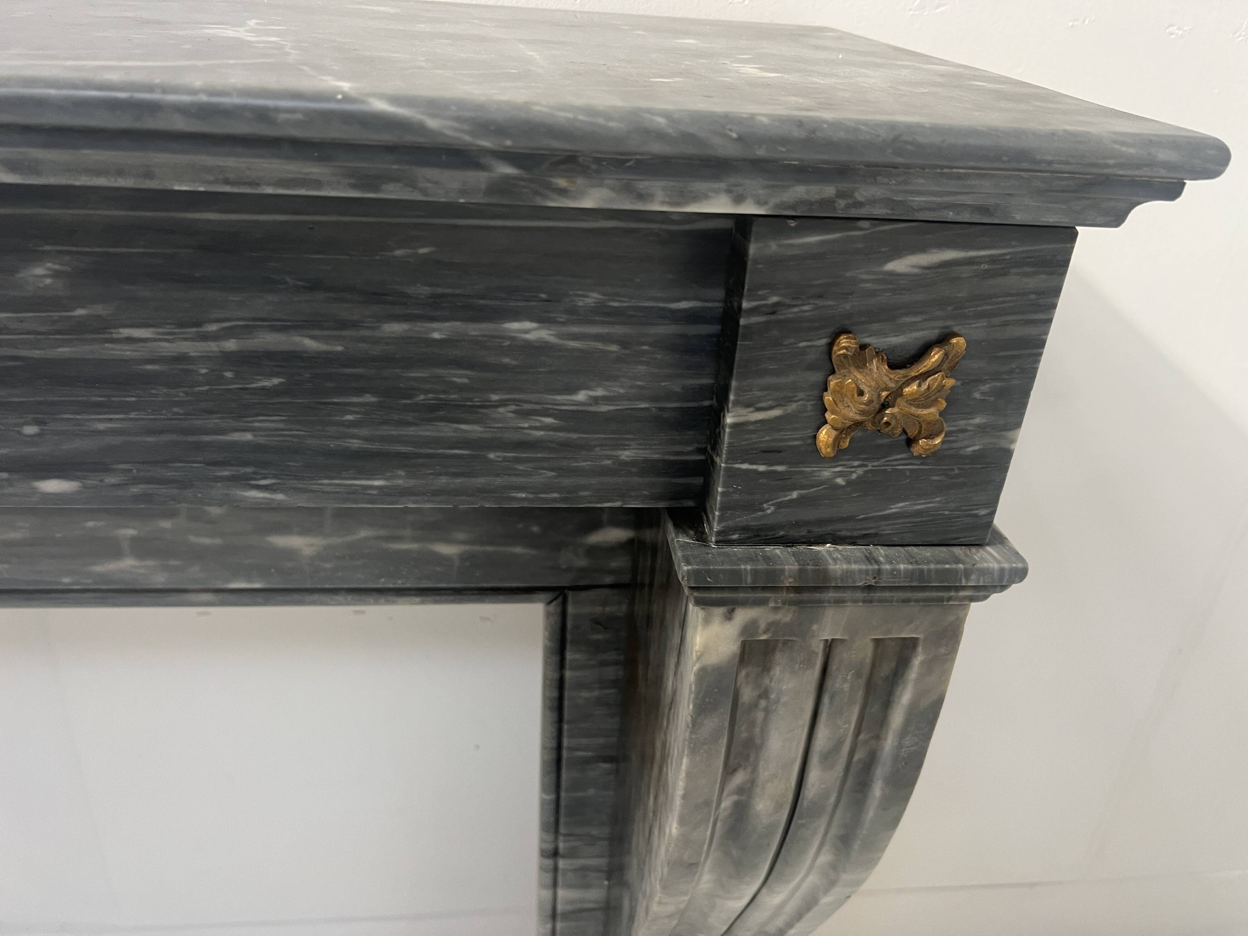 Napoleon III fireplace in blue Turquin marble from the 19th century.