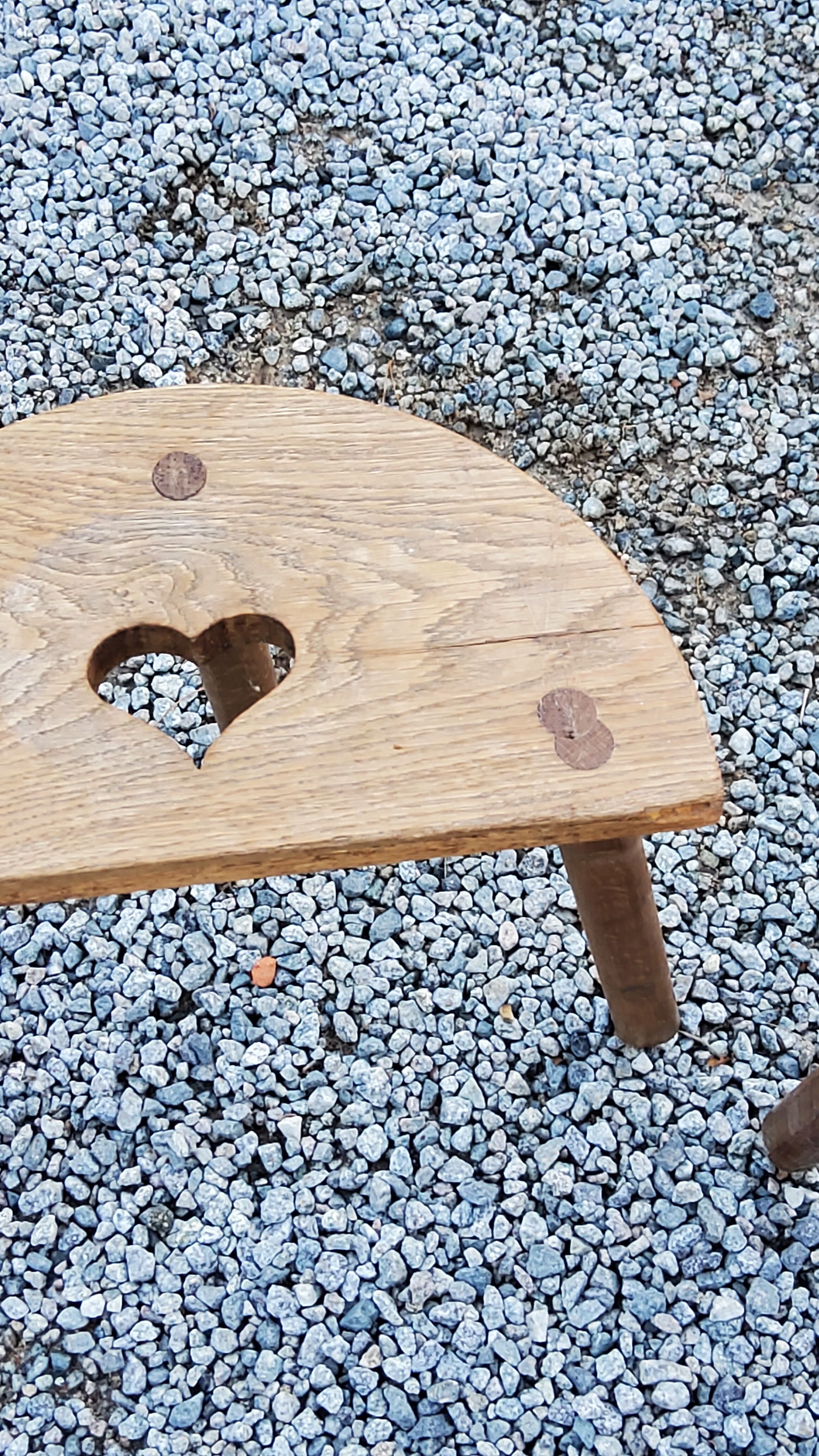 Pair of shepherd's stools in tripod oak décor in the heart
