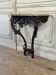 Louis XV console in carved oak, black patina, 18th century.