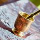 Mortar and its brass pestle with oriental gold and silver motifs