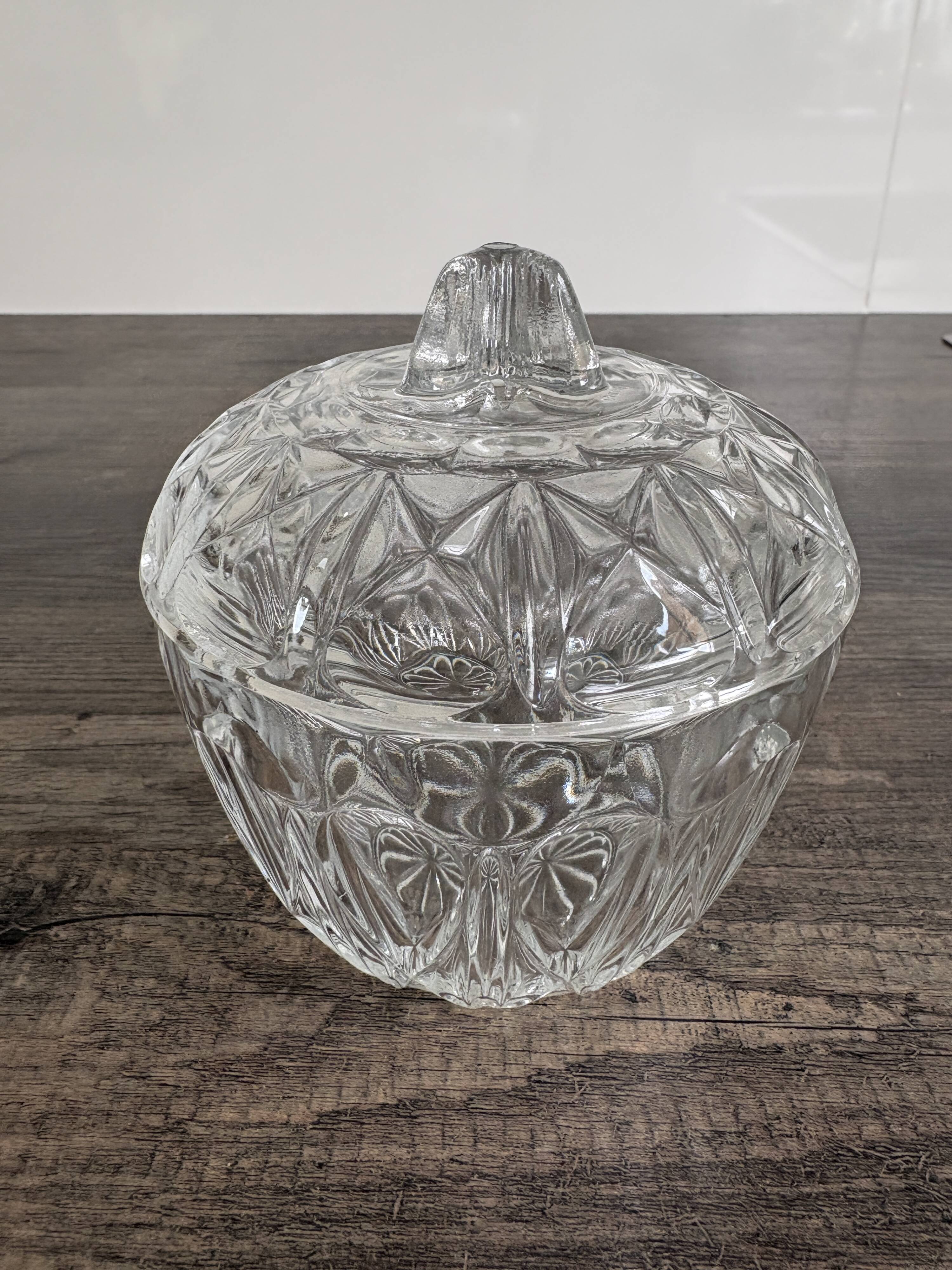 Antique covered jar in chiseled glass