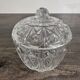 Antique covered jar in chiseled glass