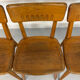 Set of 4 vintage solid oak chairs, 1960s design with sculpted backrest.