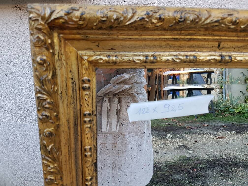 Grand golden mirror in louis xvi style