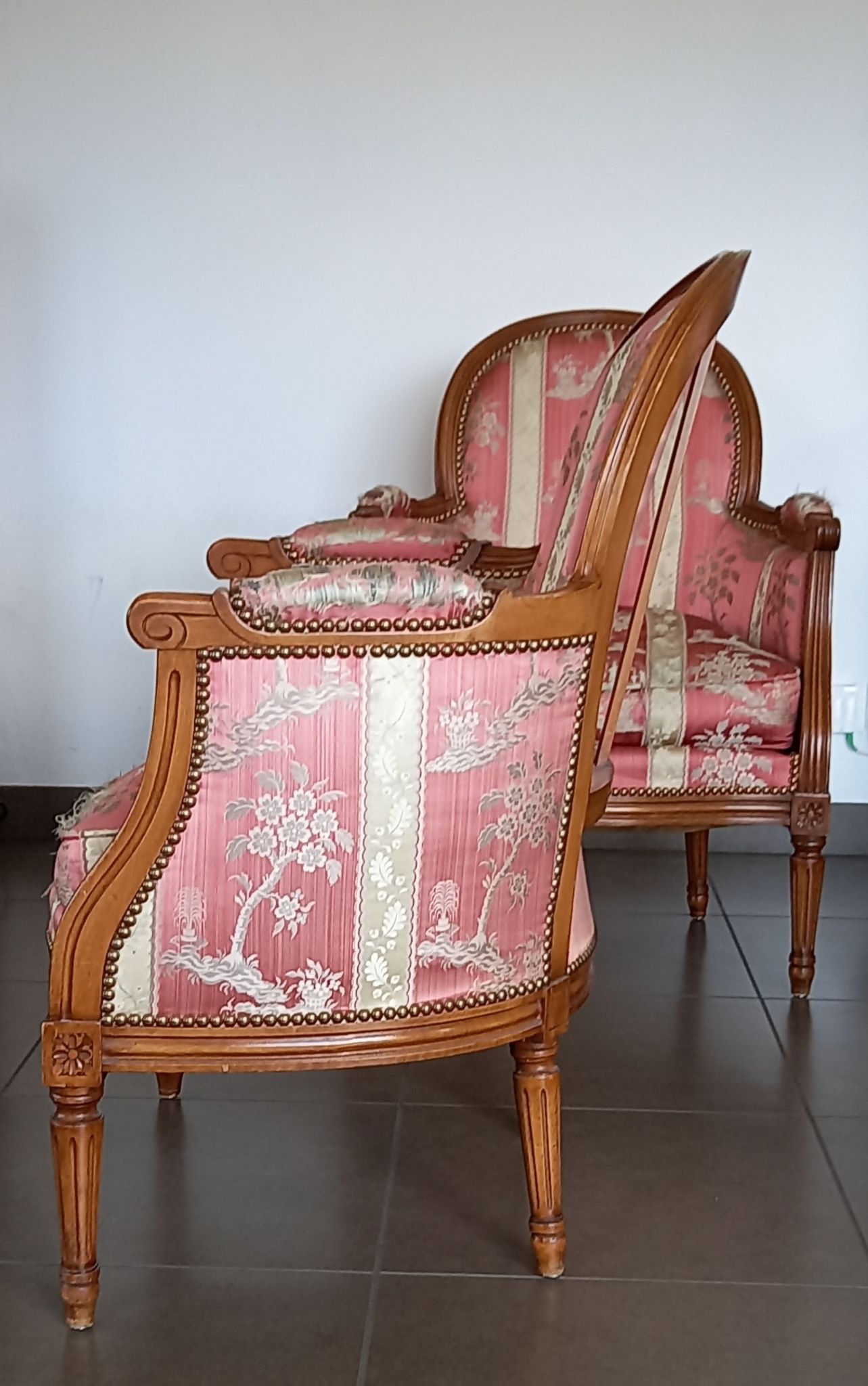 Pair of Louis XVI style armchairs in walnut and pink silk and ecru