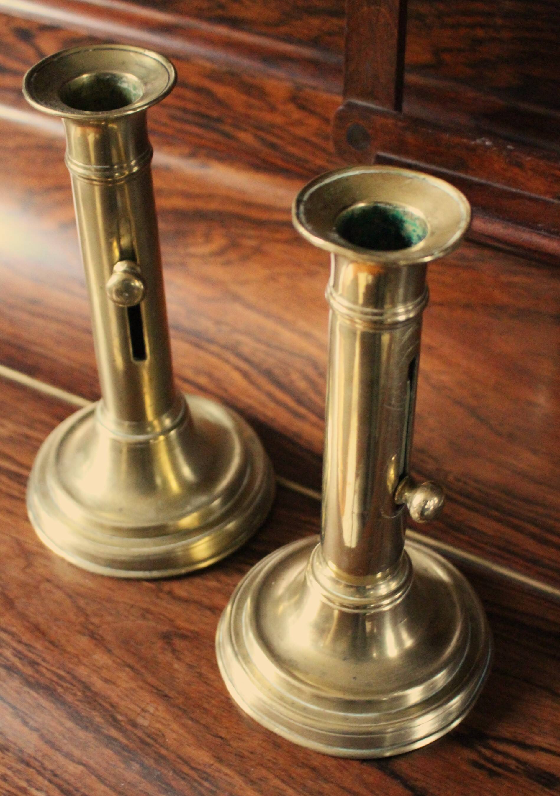 Pair of brass push-button candlesticks
