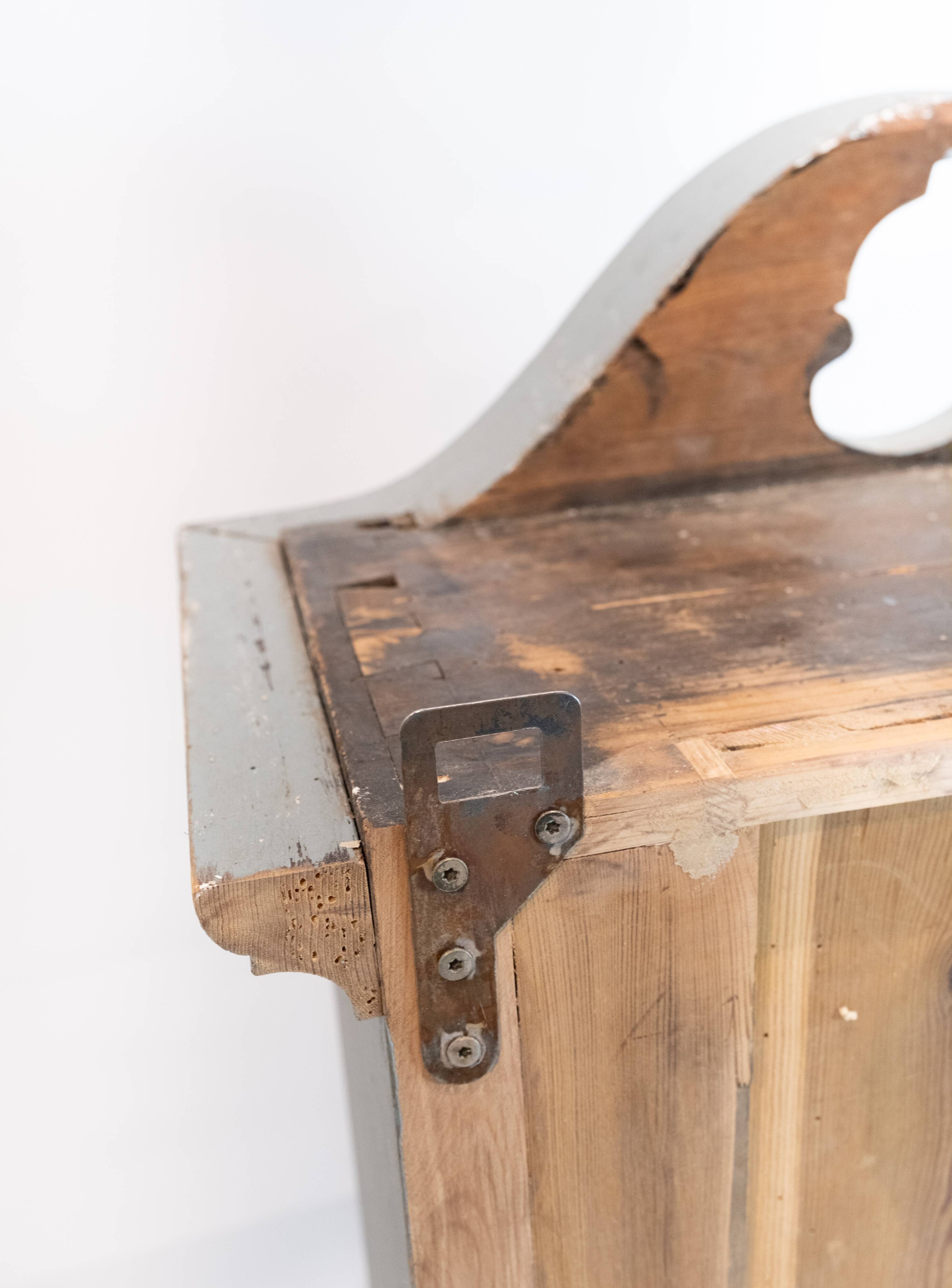 Grey painted hanging glass cabinet in gustavian style from around 1820.
