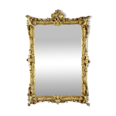 Large gilded wooden mirror in Louis XV style, 19th century.