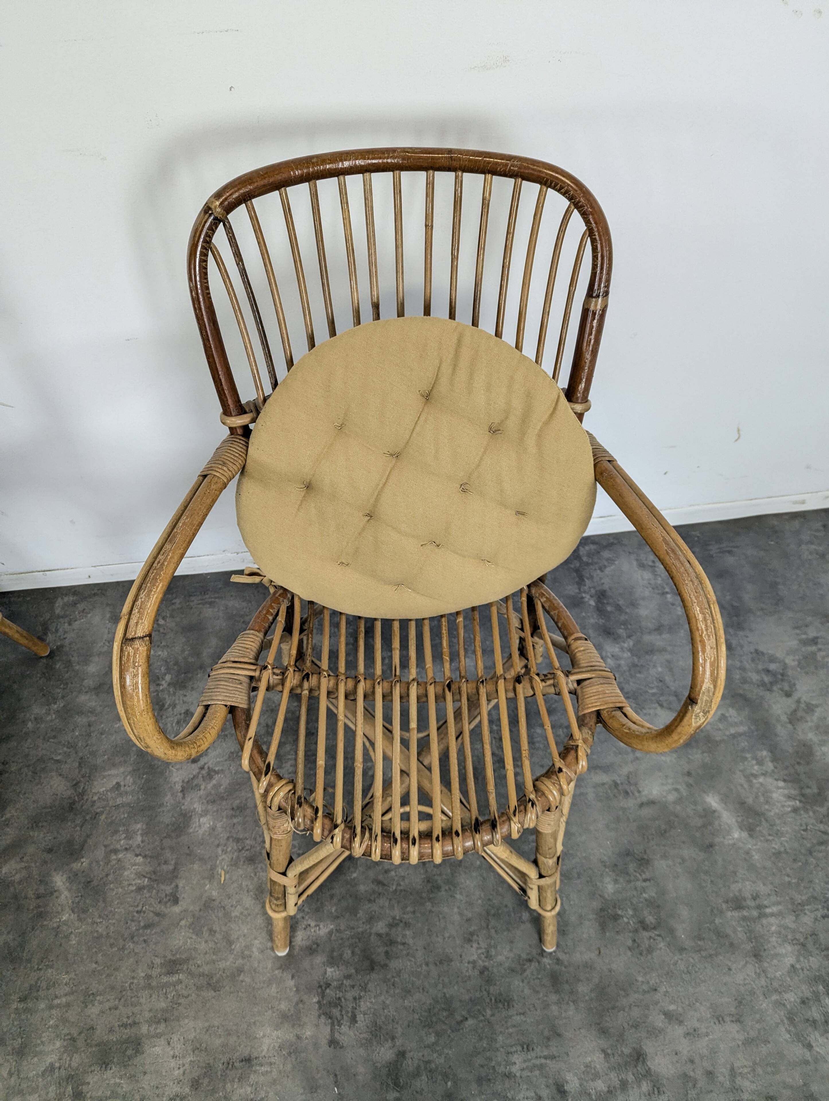 Set of 3 chairs and a rattan armchair.