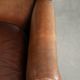 Sheepskin wingback armchair with patina finished with decorative nails