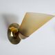 Set of three brass sconces with decorated yellow glass shades