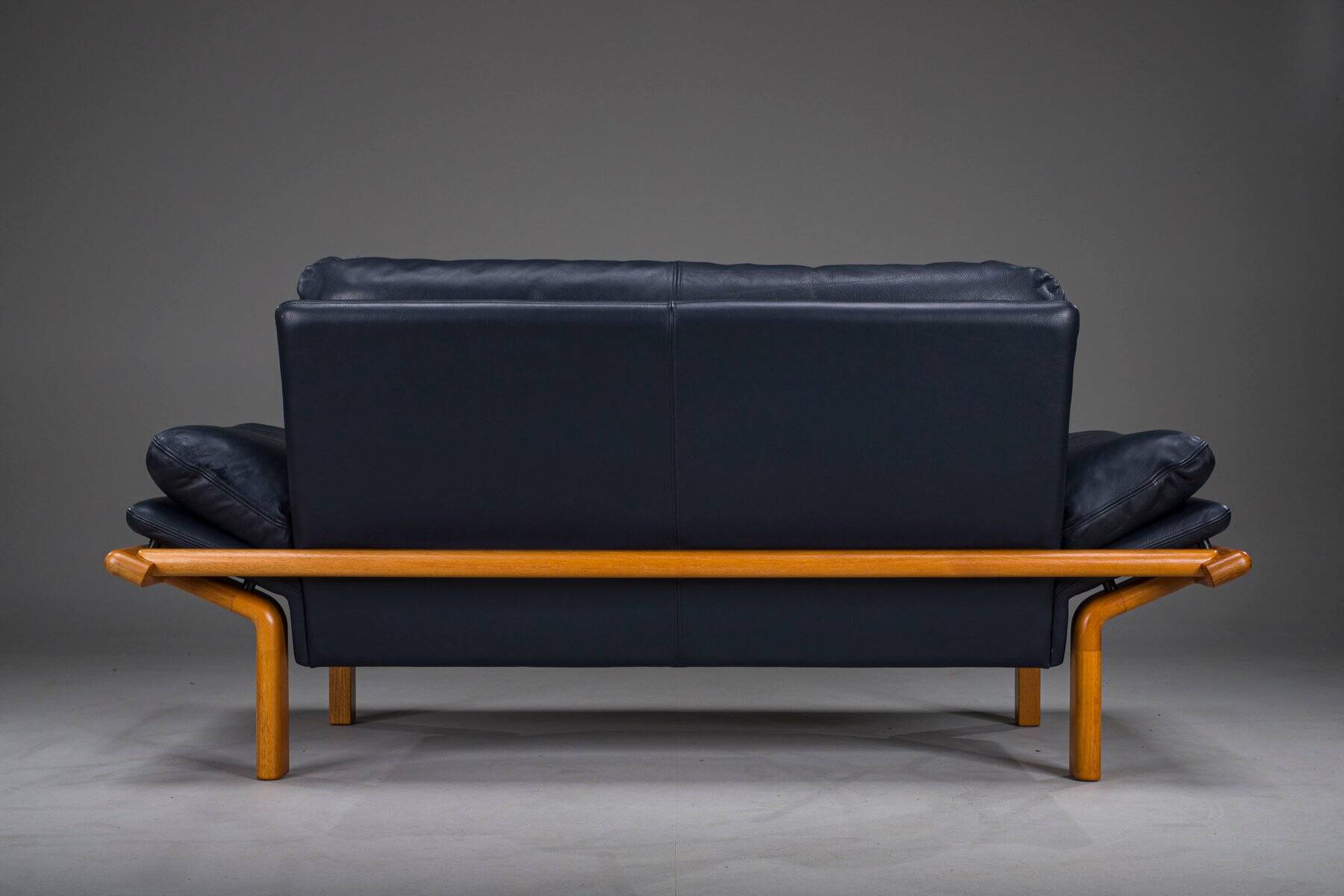 Danish teak and navy blue leather 2-seater sofa from Komfort, 1970s