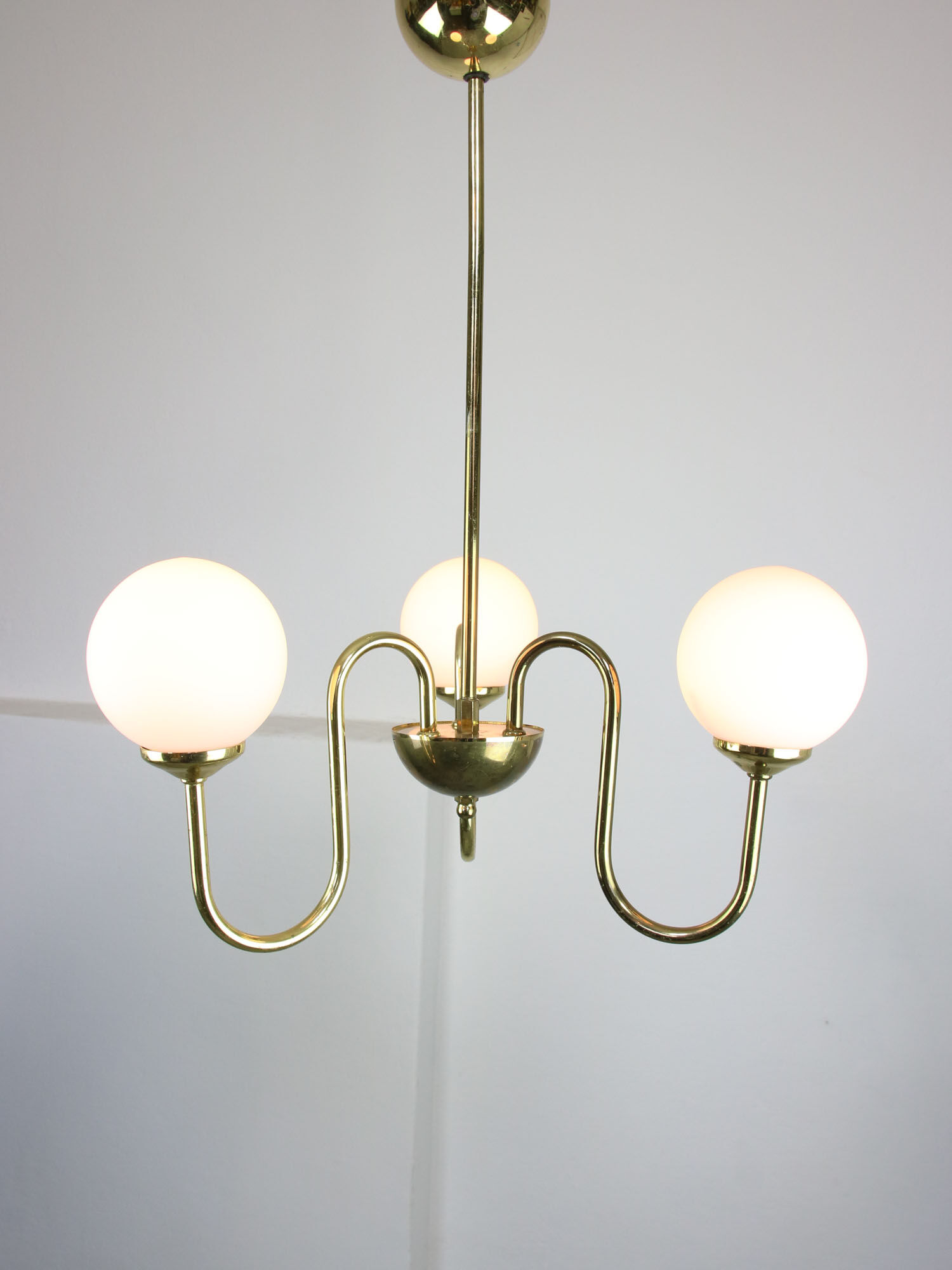 Vintage golden chandelier in opaline glass