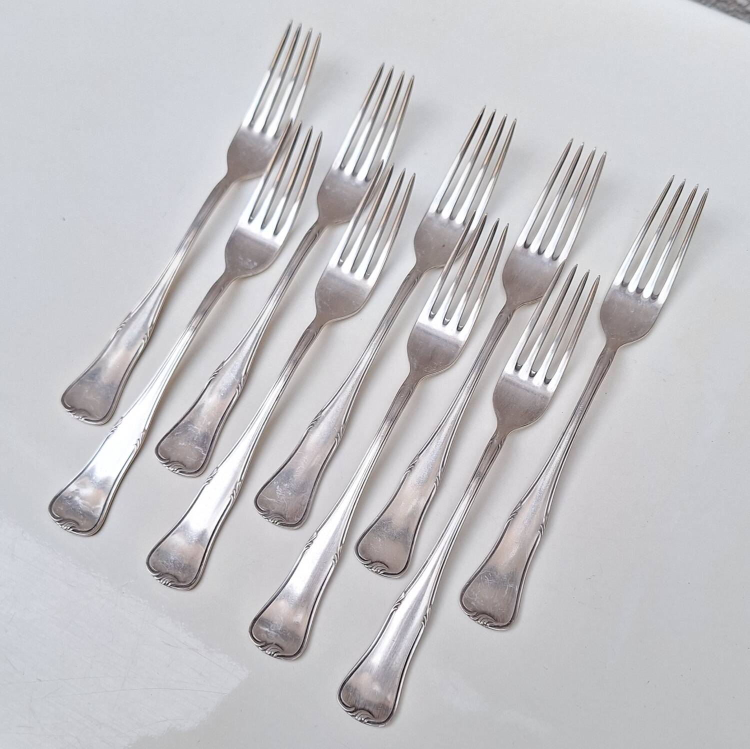 Set of small silver-plated metal forks