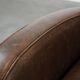 Elegant set of two sheepskin leather armchairs with beautiful round shapes