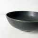 Round vintage black ceramic catchall.