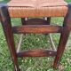 Two-seater straw bench, French rural style, wood and rush, early 20th century.