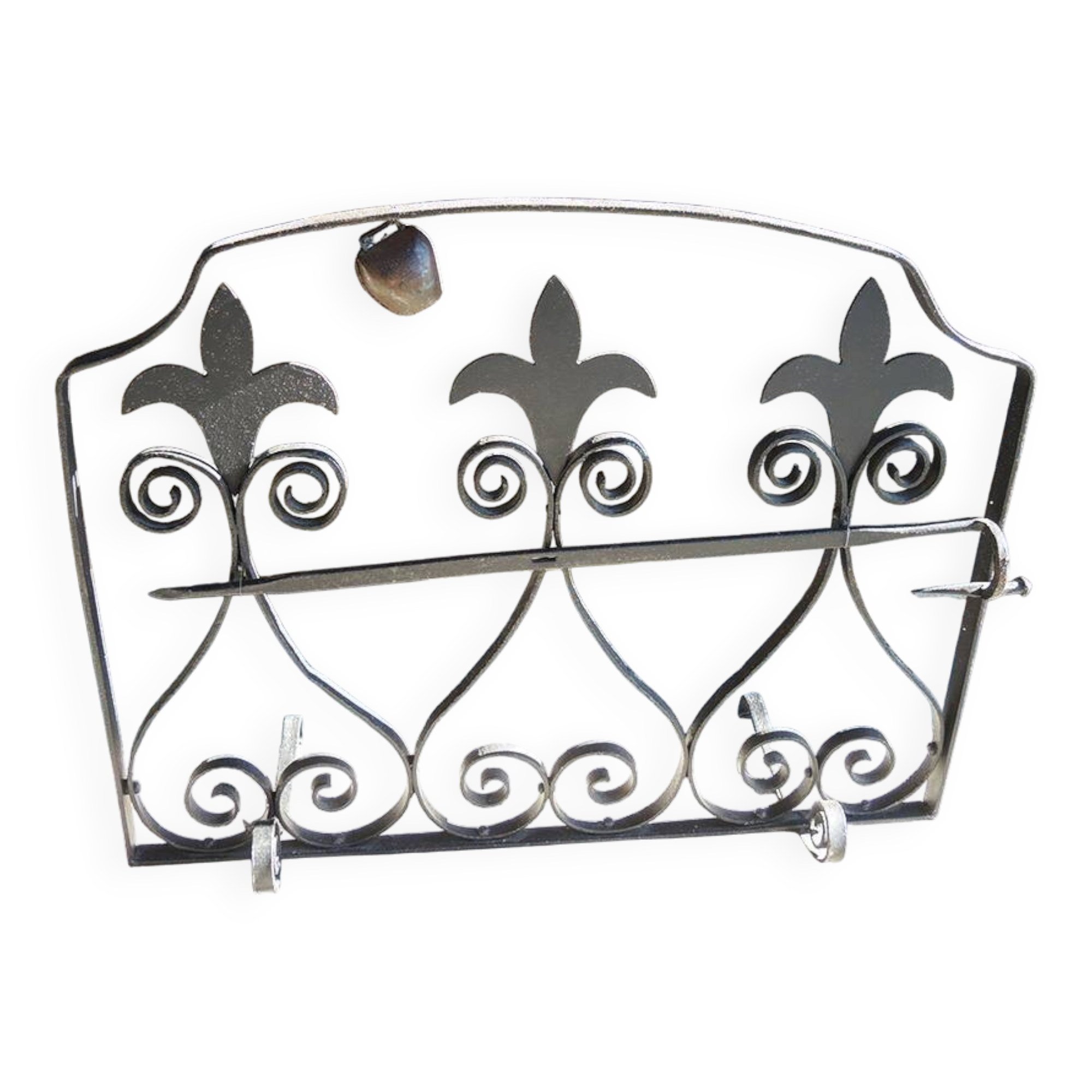 Old wrought iron fleur-de-lis fire screen