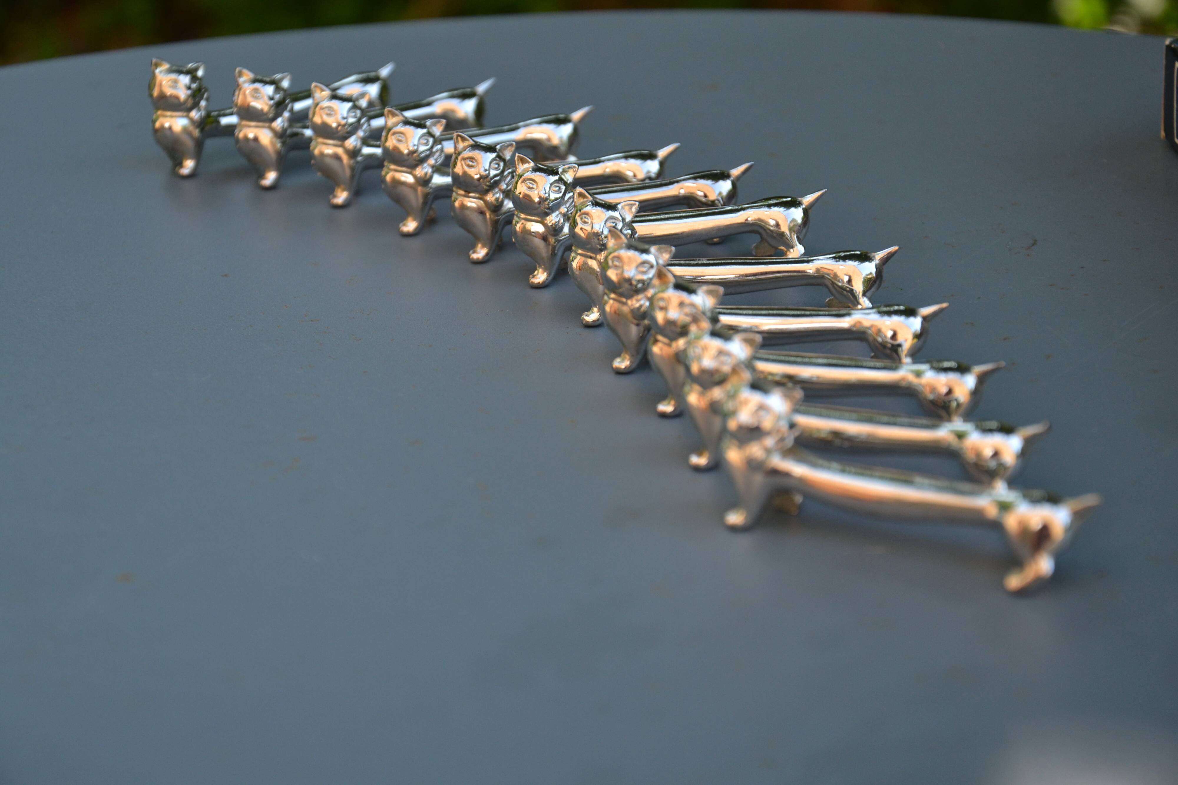 12 silver-plated cat knife rests