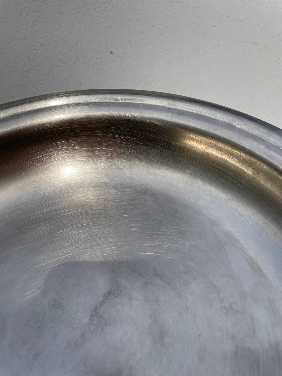Round silver-plated metal serving dish with hallmark