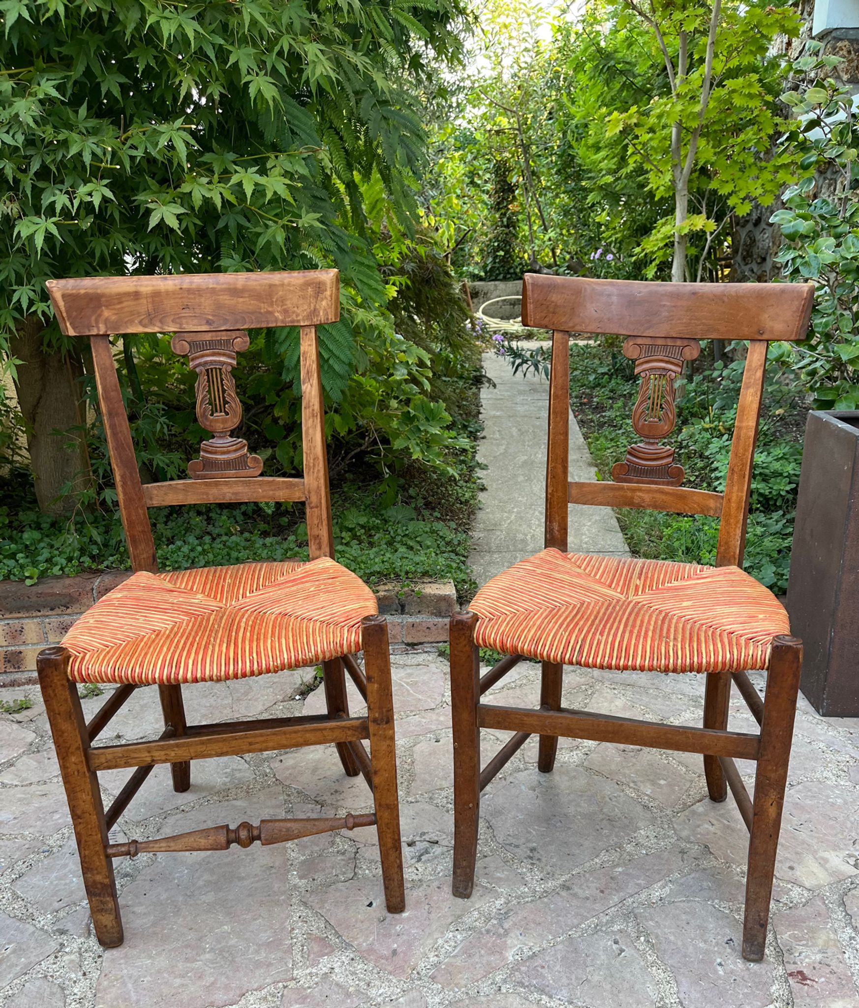 Pair of straw seated chairs