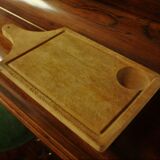 Wood cutting board with groove and handle