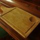 Wood cutting board with groove and handle